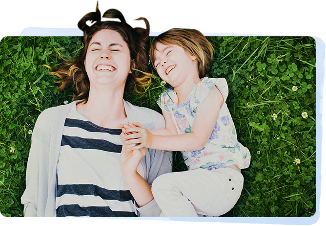 Mum and kid sleeping on the grass during parenting activities