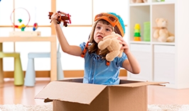 A young child exploring imagination with toys