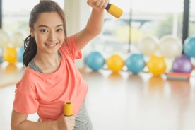 Pregnant woman working out with dumbbell 