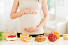 Pregnant woman with a mix of cravings lined up infront of her