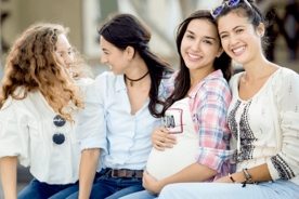 Pregnant woman hanging out with her friends