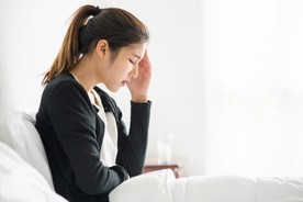 sick-woman-had-headache-hands-touched-her-head-bed