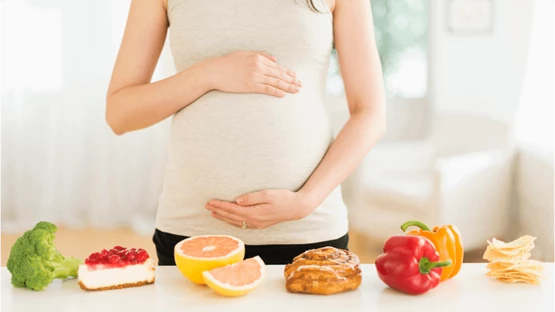 Pregnant woman with a mix of cravings lined up infront of her