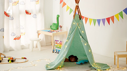 Fairy lights wrapped around homemade tent